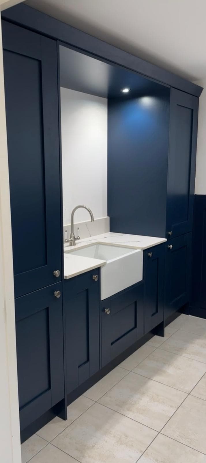 Navy boot-room storage with Belfast sink