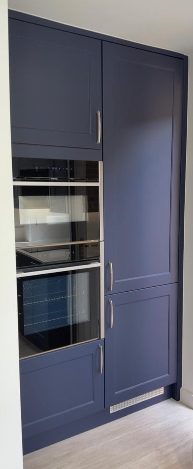 Navy built-in oven tower with wine fridge
